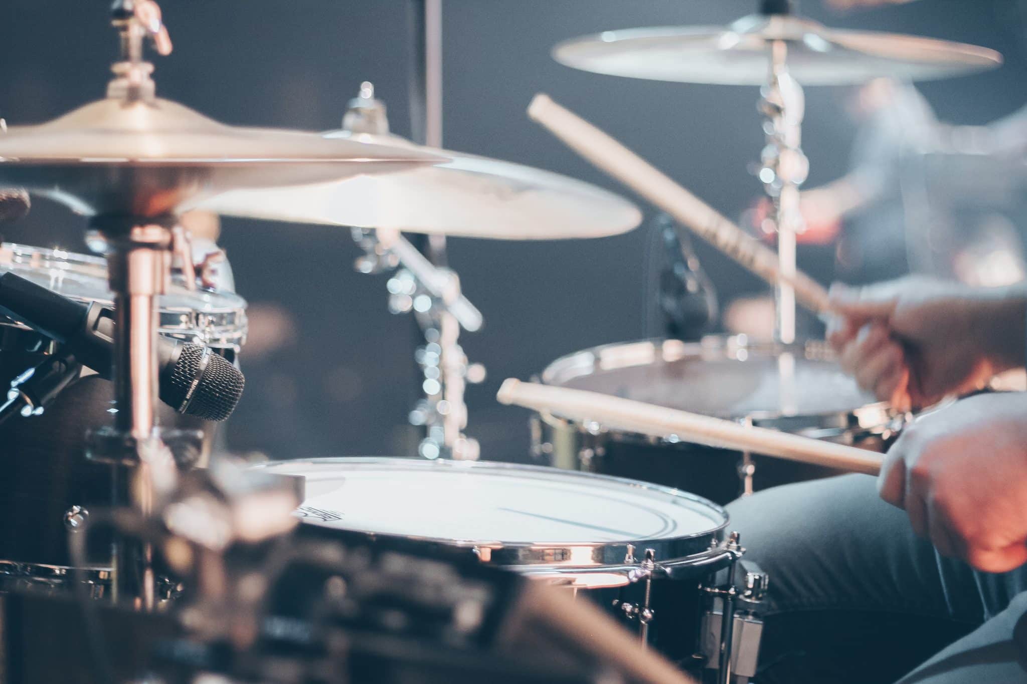 Close up of a musician playing drums.